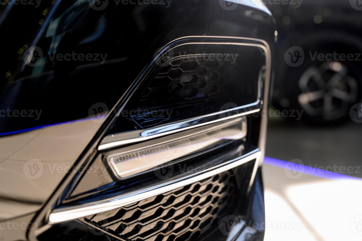 Close up of the headlight of a new modern car photo