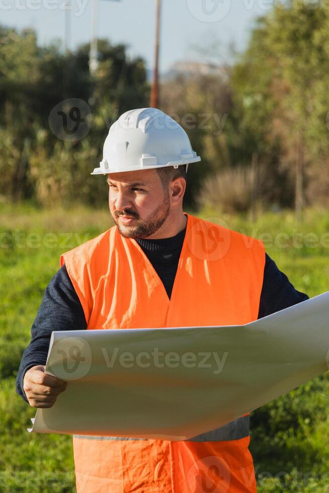 Building Engineer On The Green Grass photo