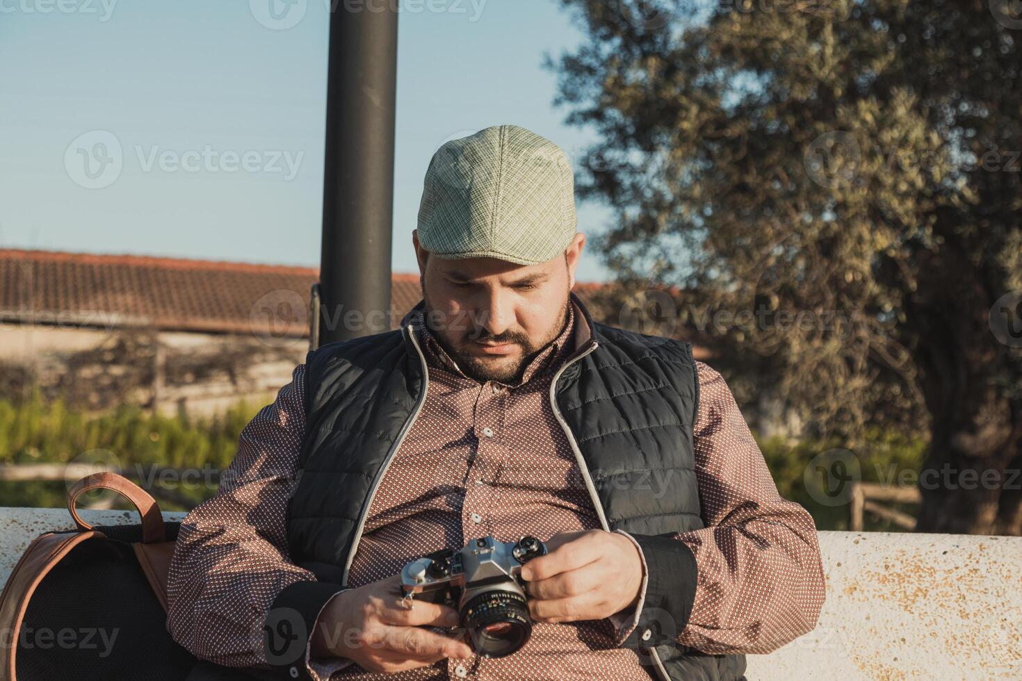 Photographer Rewatching The Photos Made During The Day