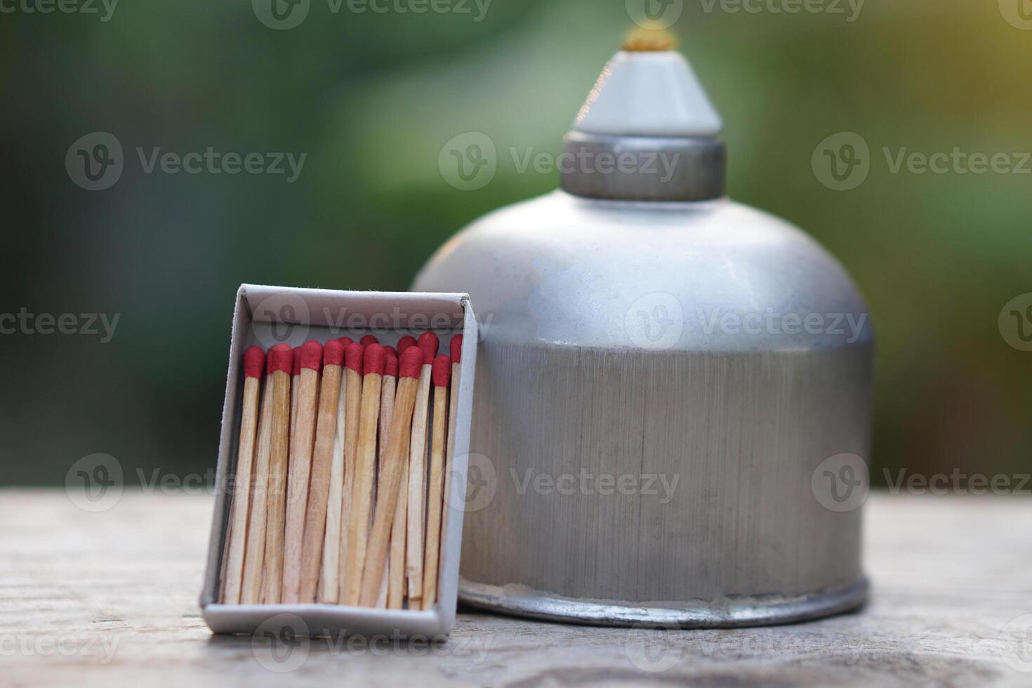 Stainless steel alcohol burner lantern. Laboratory lamp and box of matches. Concept, equipment or tool for science experiment. Educational toolkit photo
