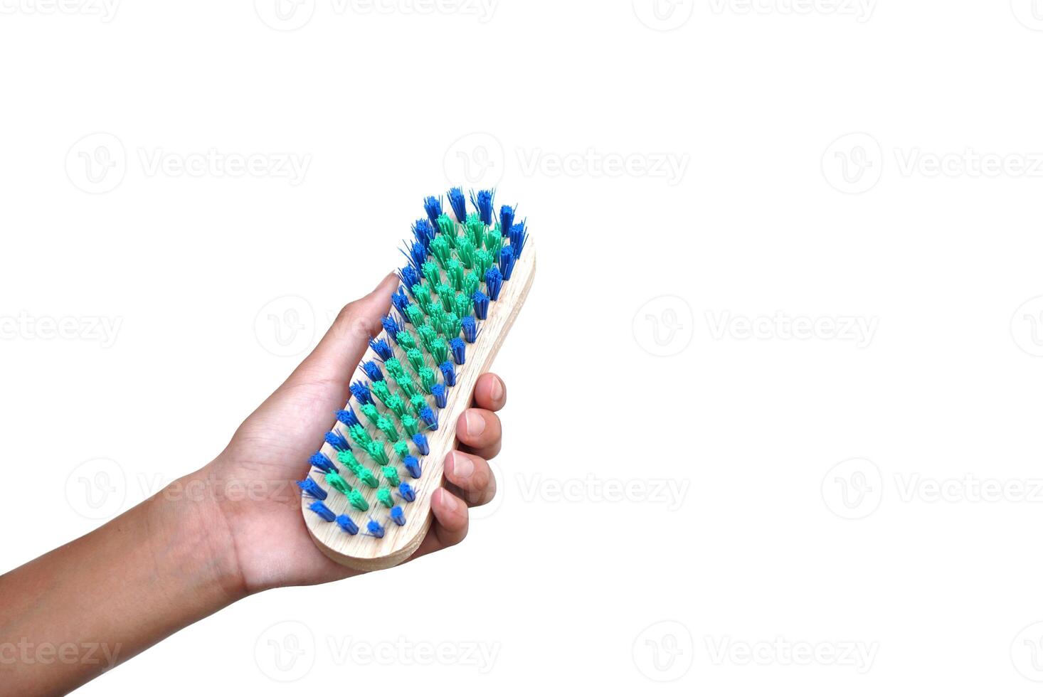 Hand hold brush for scrub dirty cloth, isolated on white background. Concept, equipment for washing, scrubbing and cleaning dirty cloth, carpet or surface. Daily chores tool. photo