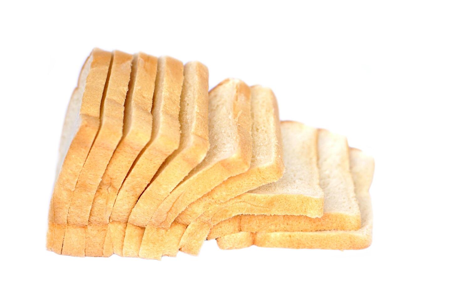 Loaf of homemade slide soft bread isolated on white background. Concept, food for breakfast. photo