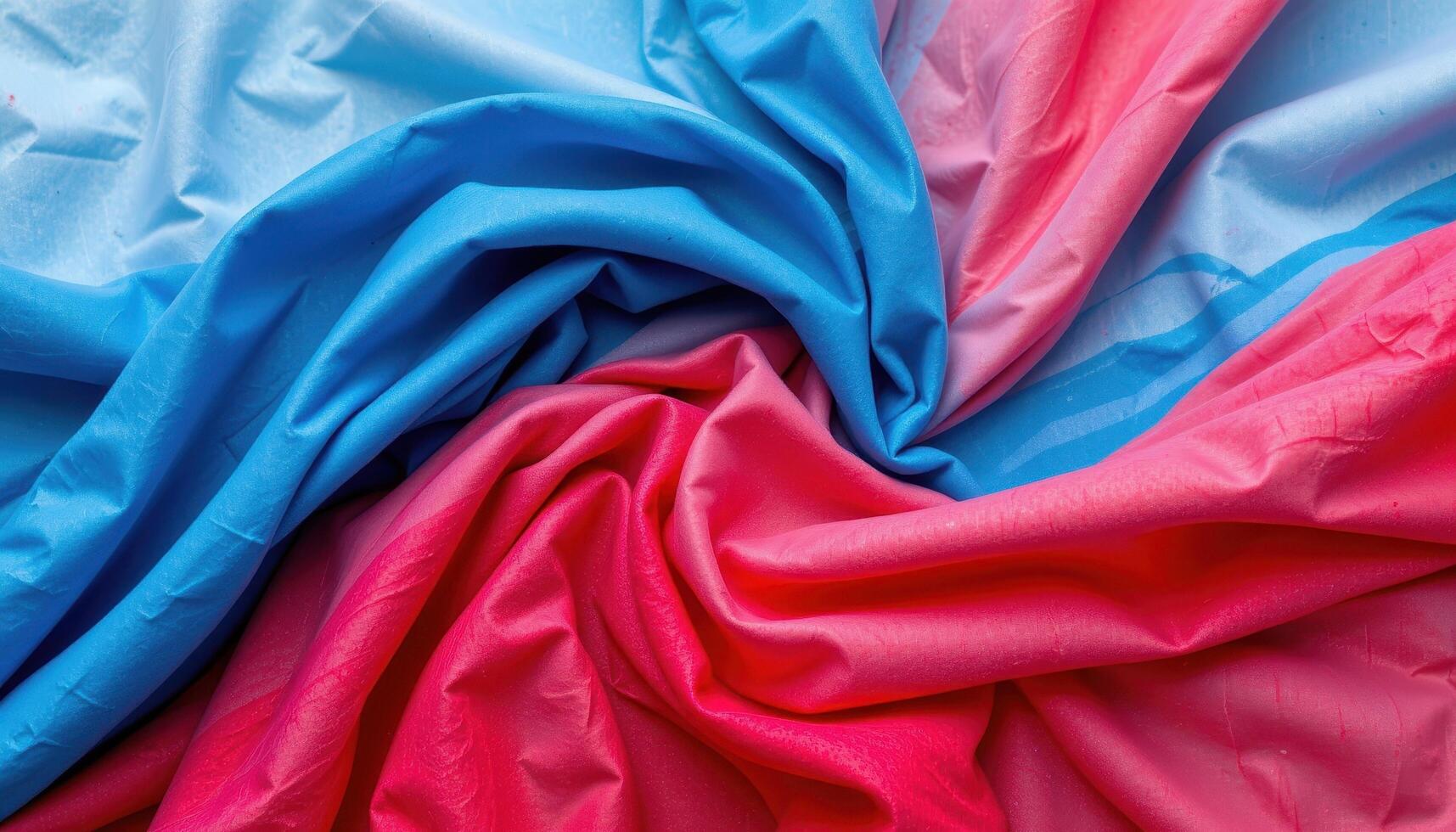 Abstract colorful fabric background in red, blue, and white, textured folds and movement photo