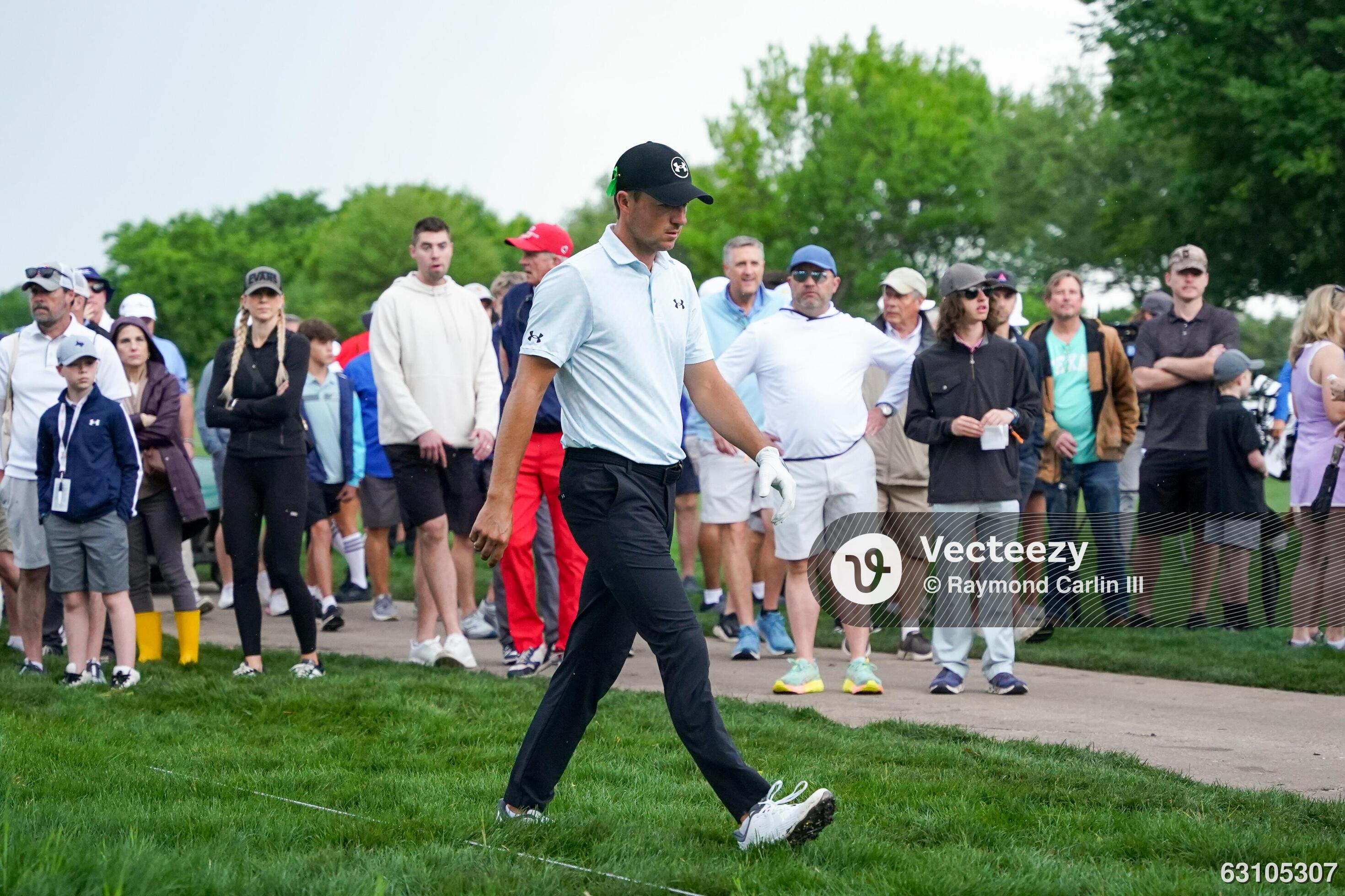 Jordan Spieth prepares to play his second shot on the 12th hole during