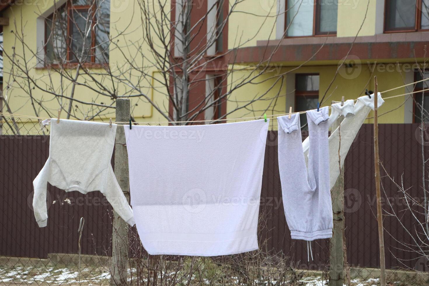 Drying your laundry outdoors on a clothesline during the winter season is truly a unique experience photo