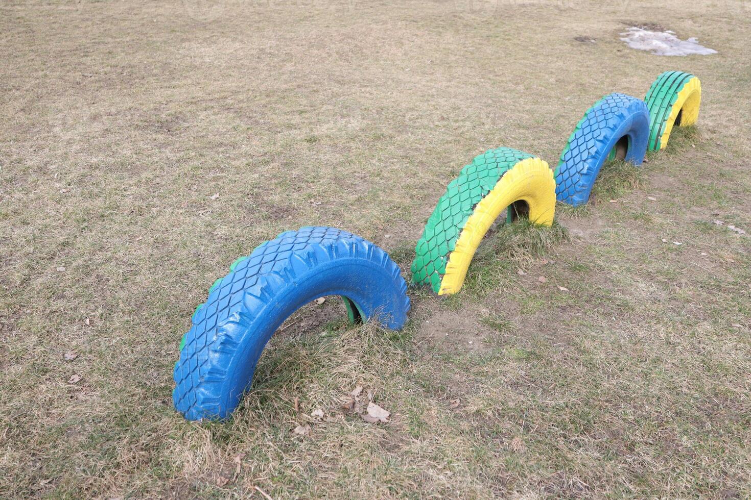 Vibrant and Colorful Playground Equipment Made from Tires for Children to Enjoy and Explore photo
