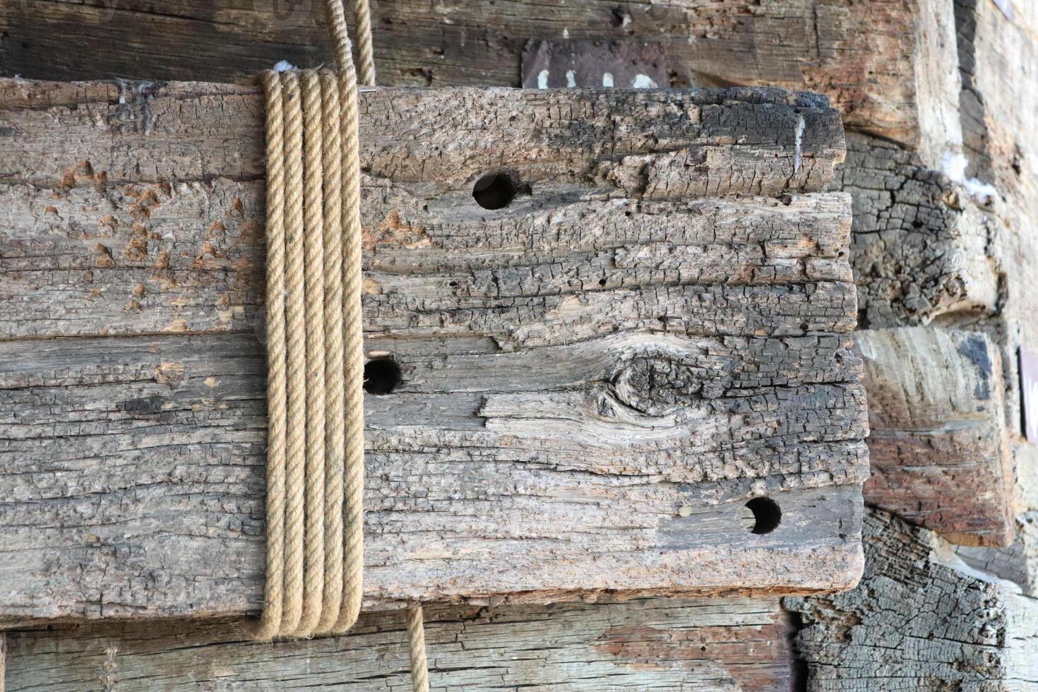 Rustic Wood Planks Beautifully Bound with Twine, Adding Charm and Character to Spaces photo