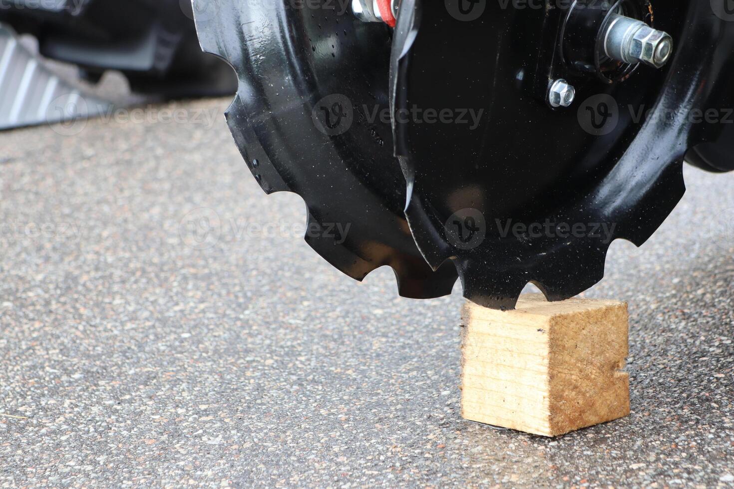 A Heavy Machinery Tire resting on a Wood Block designed for Elevated Support needs photo