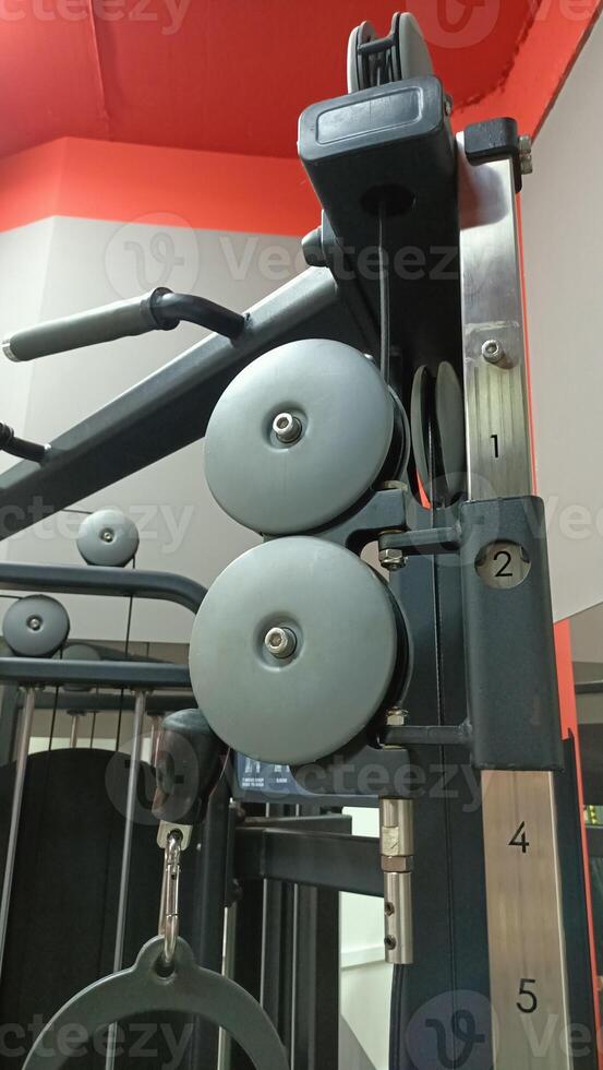 The Pulley System for Weights at the Gym Designed for Effective Strength Training Sessions photo