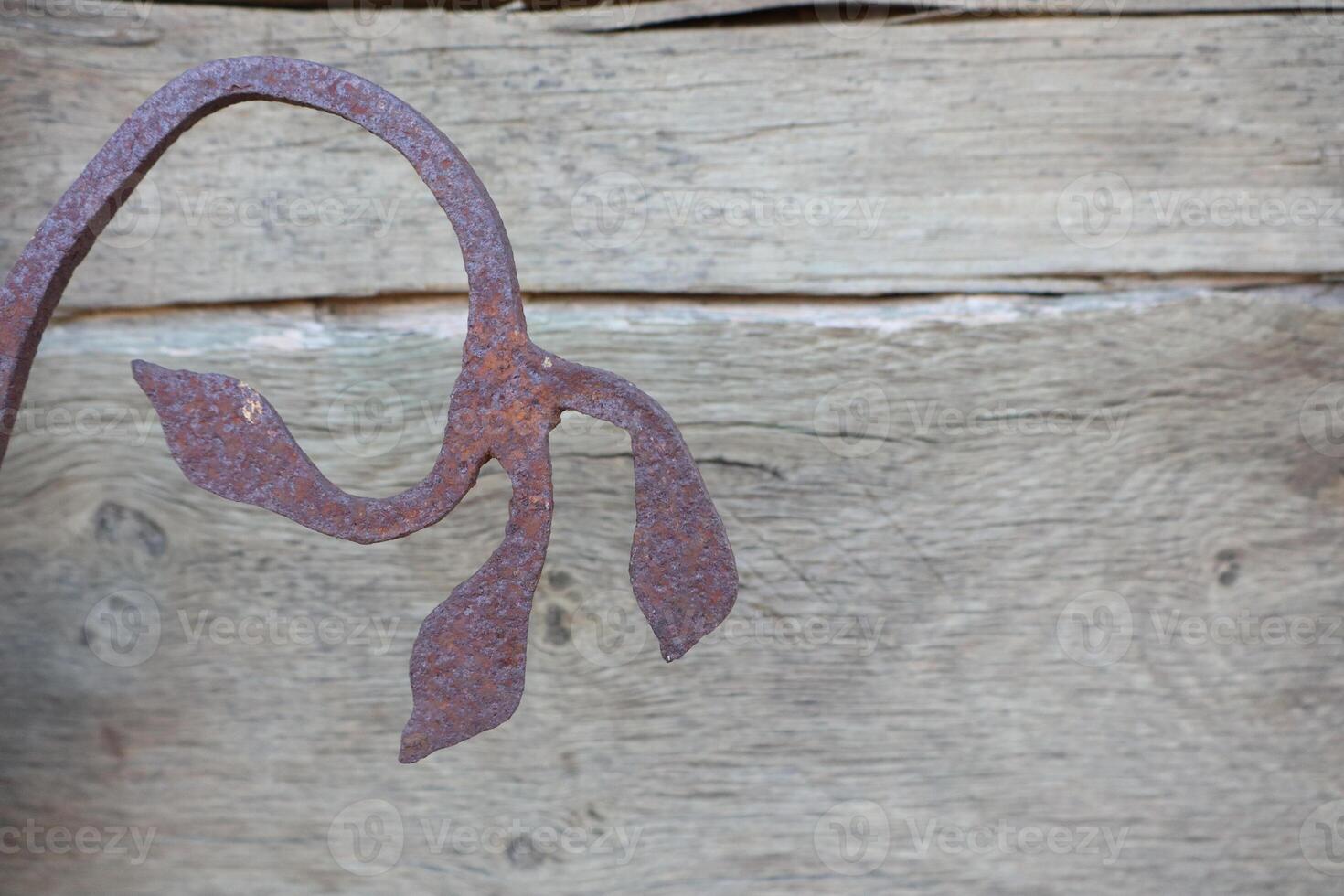 Rustic Iron Leaf Design Crafted with Care on Beautiful Wooden Background Setting photo