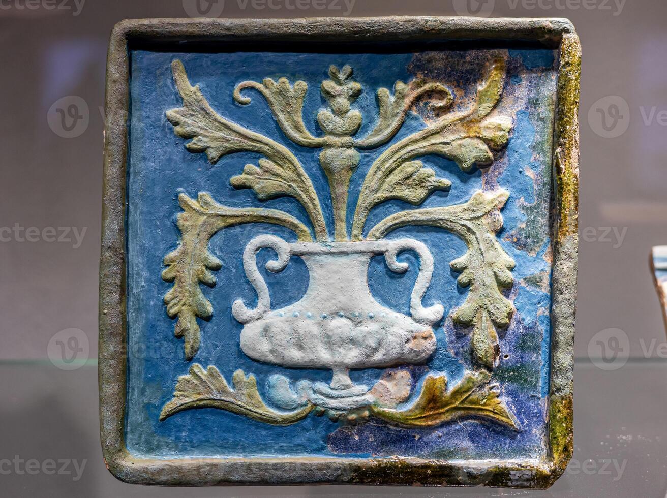 A blue and white ceramic vase with a design on it photo