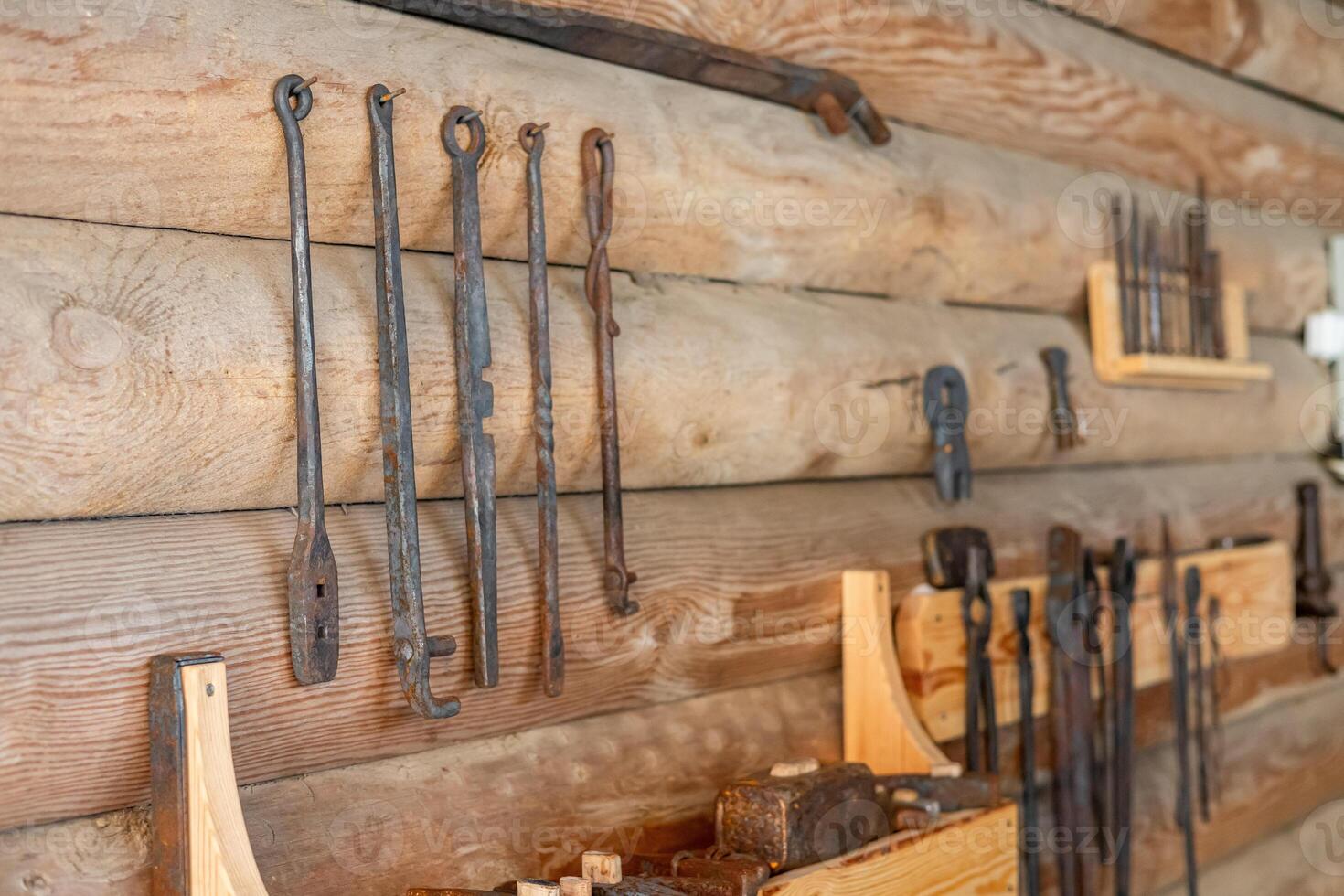 A wall with various tools hanging on it photo