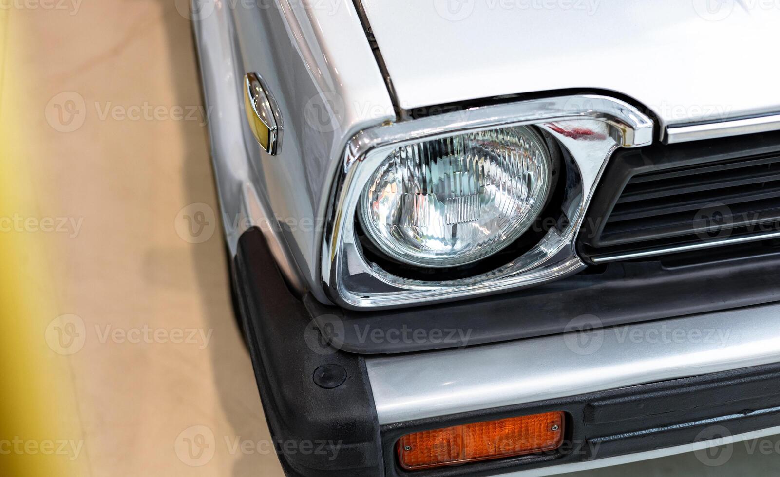 A close up of a car's headlight photo