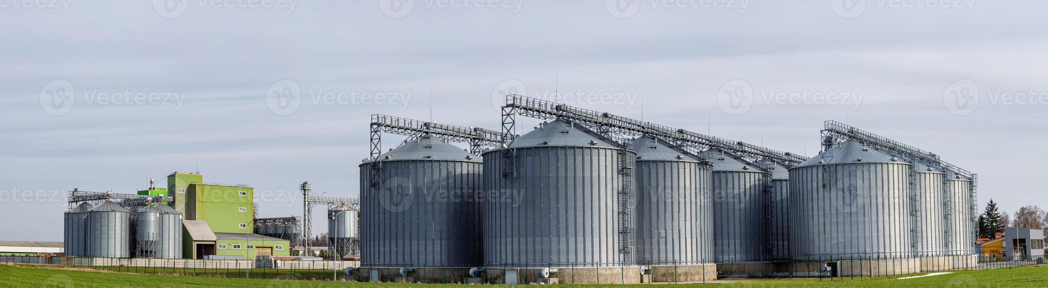 Grain silos in a field photo