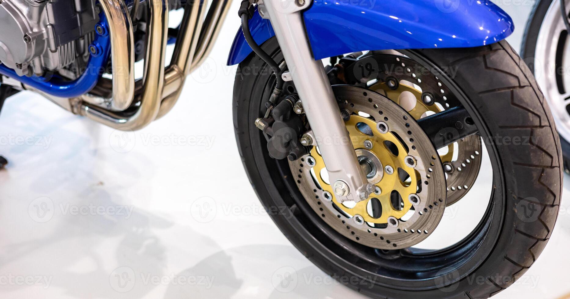 A close up of a motorcycle with a brake disc photo