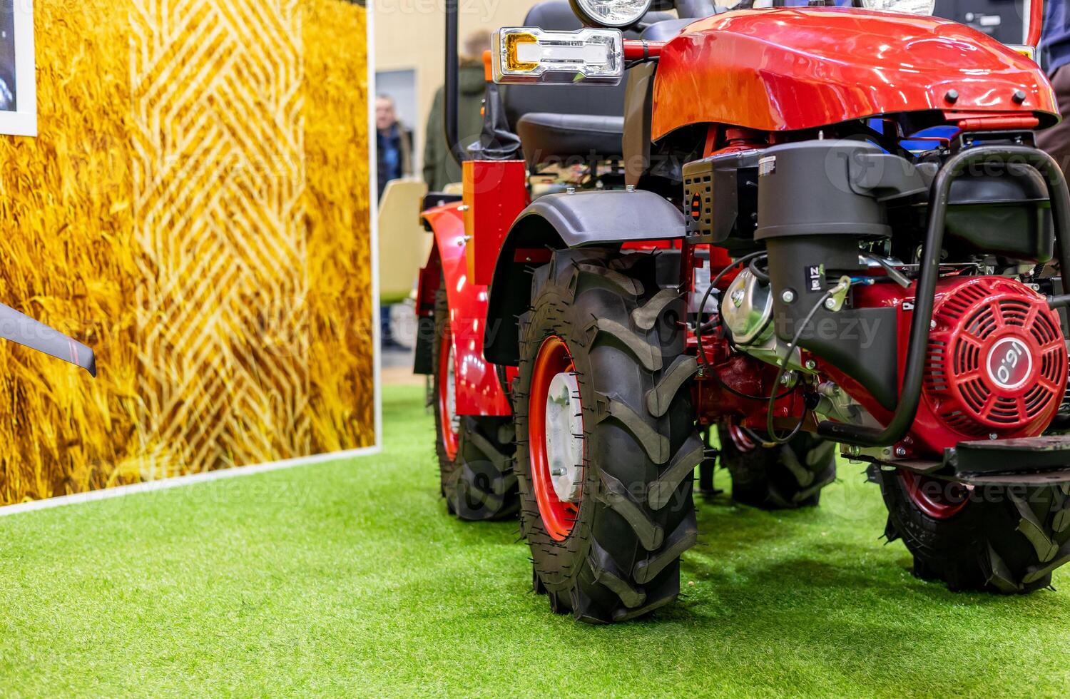 A red tractor on display at an agricultural show photo