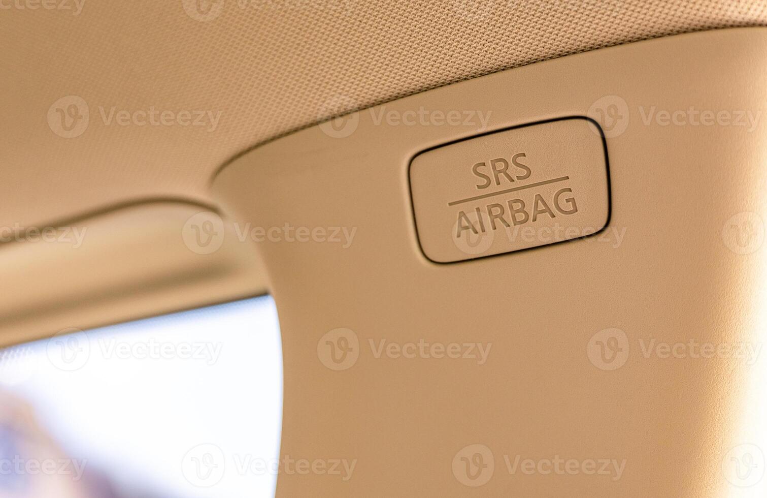 A car seat with an airbag button on it photo