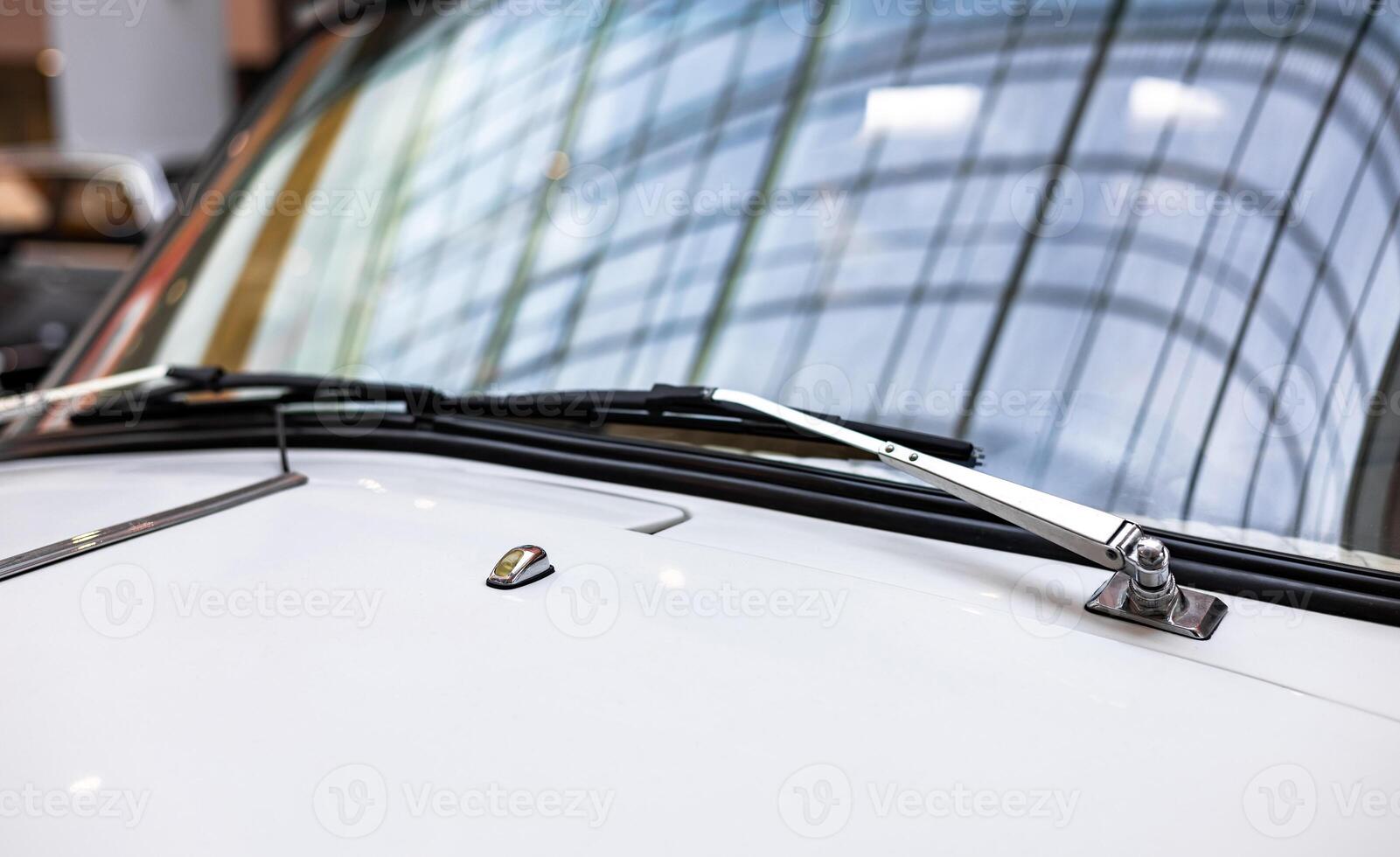 A close up of the windshield of a classic car photo