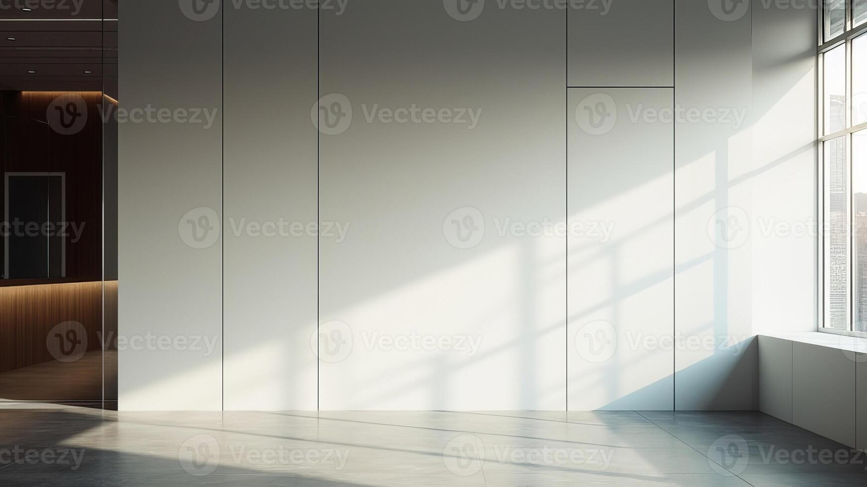Empty modern interior with a white wall illuminated by window sunlight and shadows photo