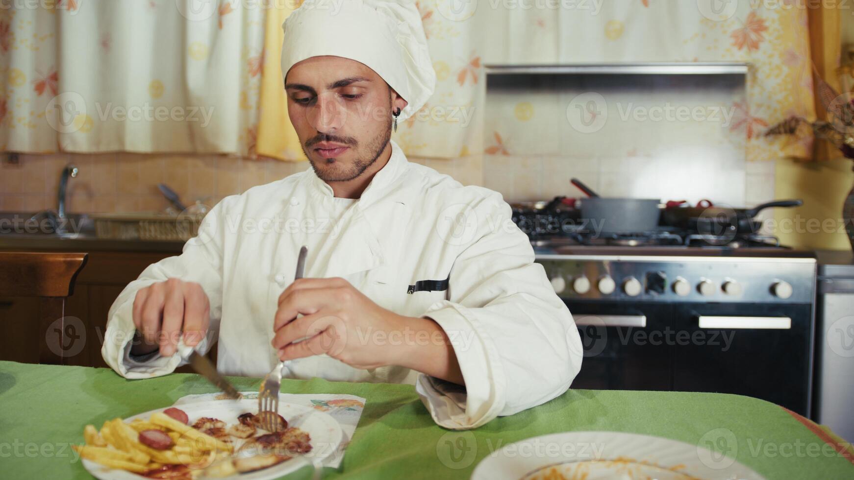 Close up Humble Man Chef Eats Food At Home Before Service At Private Restaurant photo
