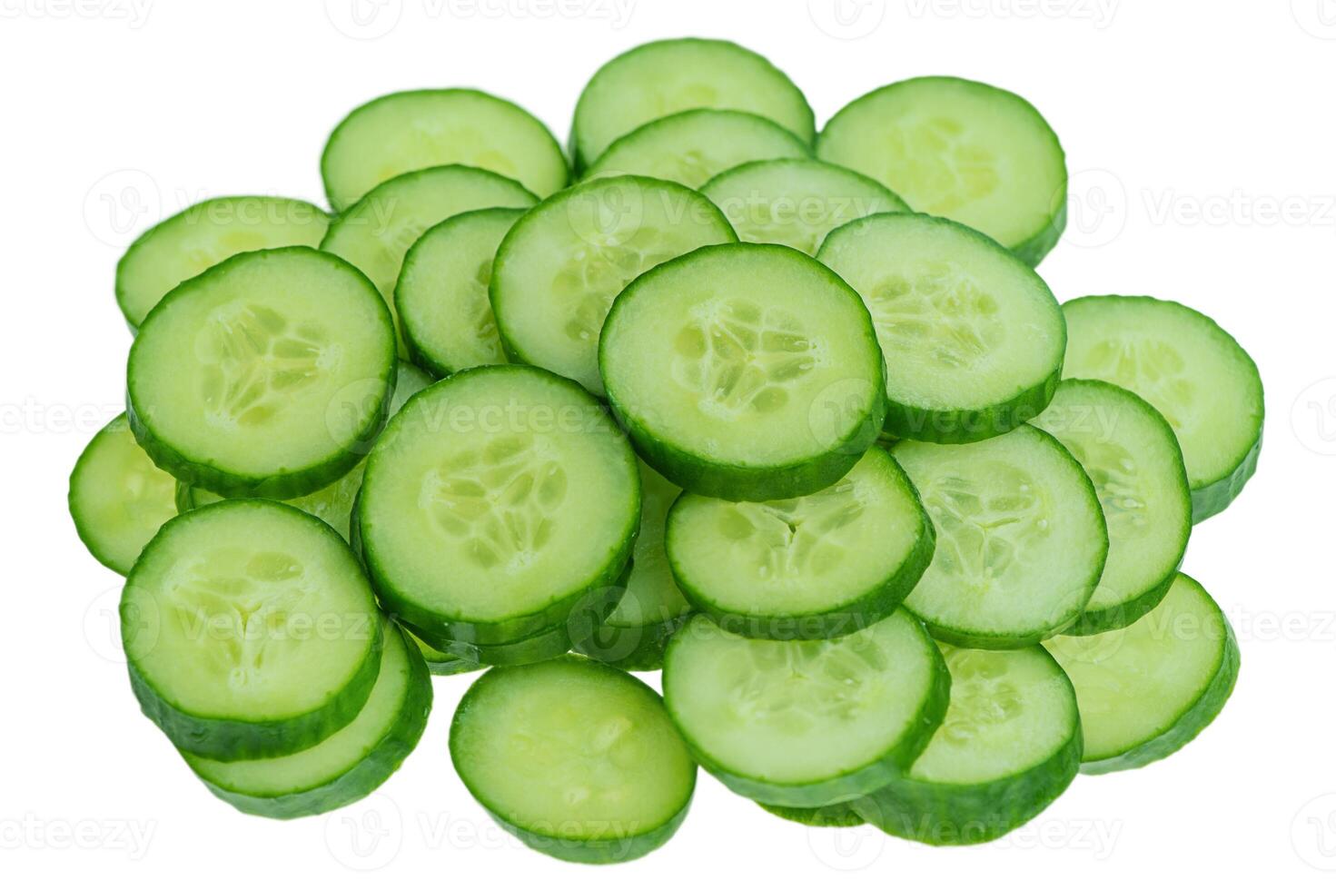 Thinly sliced cucumbers isolated on a white background. photo