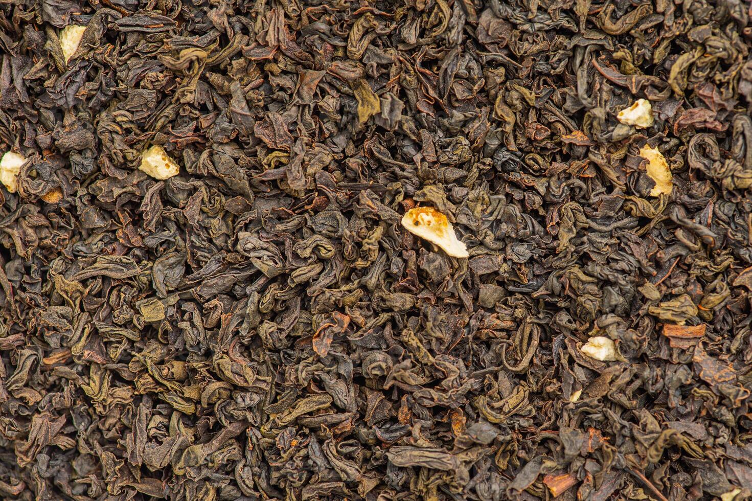Black tea with bergamot macro photo as background. Drink, loose leaf tea.