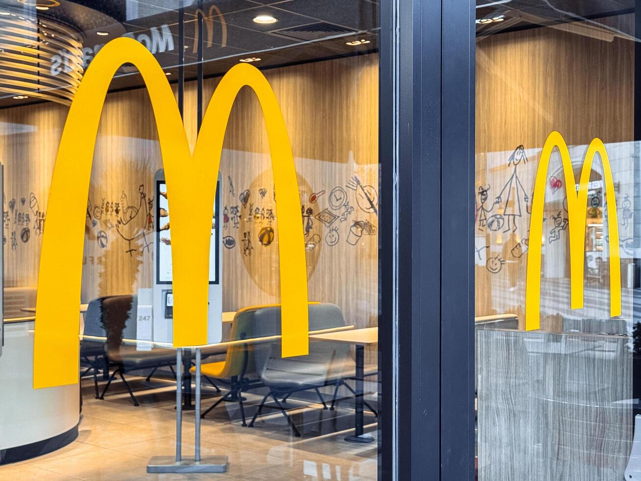 Antalya, Turkey - March 12, 2025 McDonalds logo. A large yellow arches on door photo