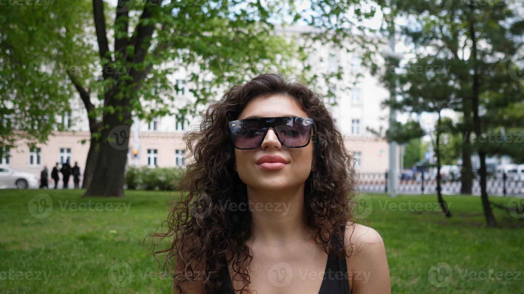 Beautiful woman portrait in a city park in summertime photo
