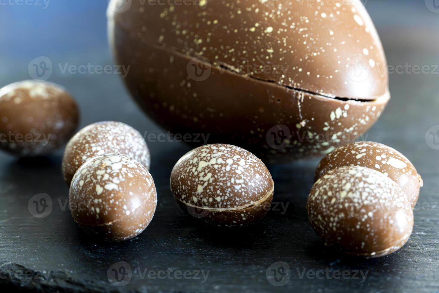 Easter egg stuffed with chocolate candies. photo