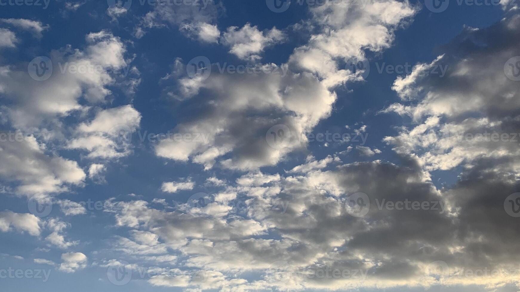 a view of the sky with clouds and a blue sky photo