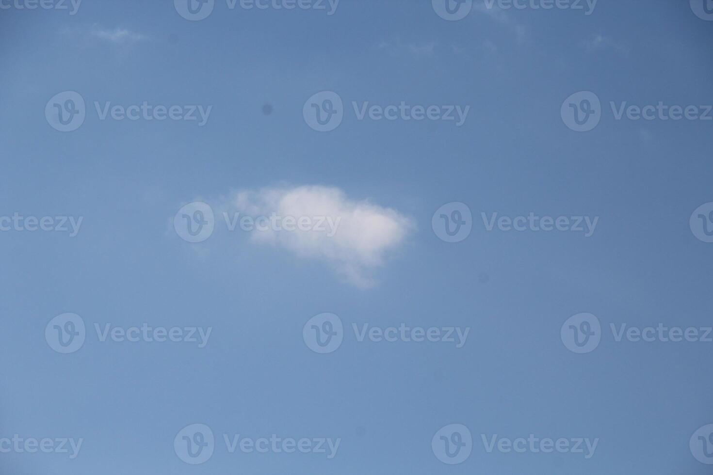 a white cloud in the sky photo