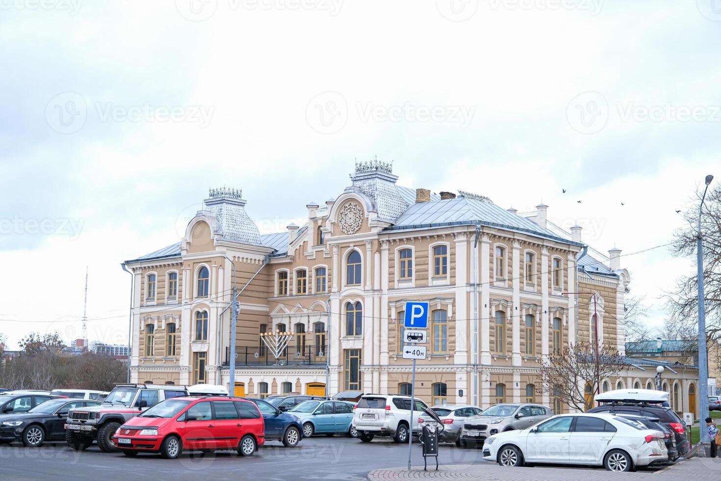 Grodno, Belarus, 03.01.2025 A large building with a clock on the front photo