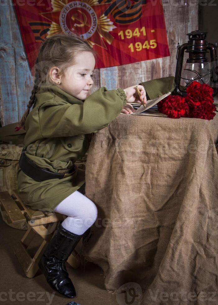 moscow, russia, 02.05.2015. small girl in a military uniform at a photo shoot for the Victory Day