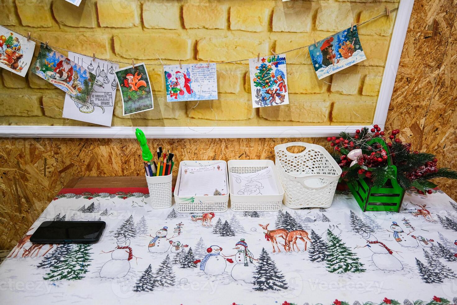 Grodno, Belarus, 03.01.2025 A table with a white tablecloth and a Christmas tree pattern photo
