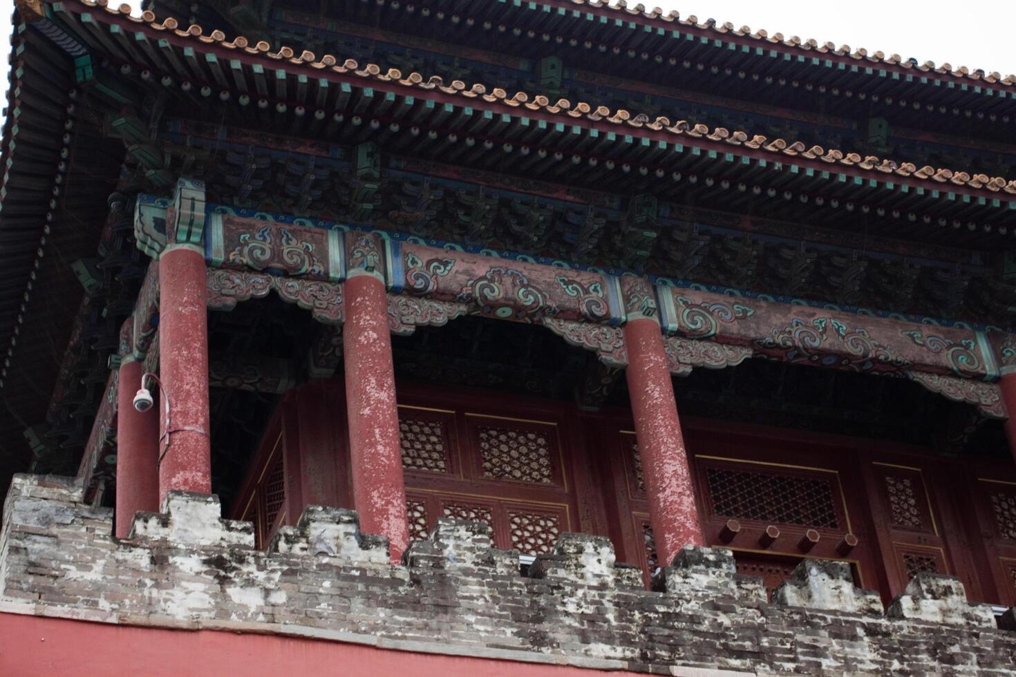 Beijing, China, 14.07.2010. The building has a red roof and is decorated with intricate designs photo