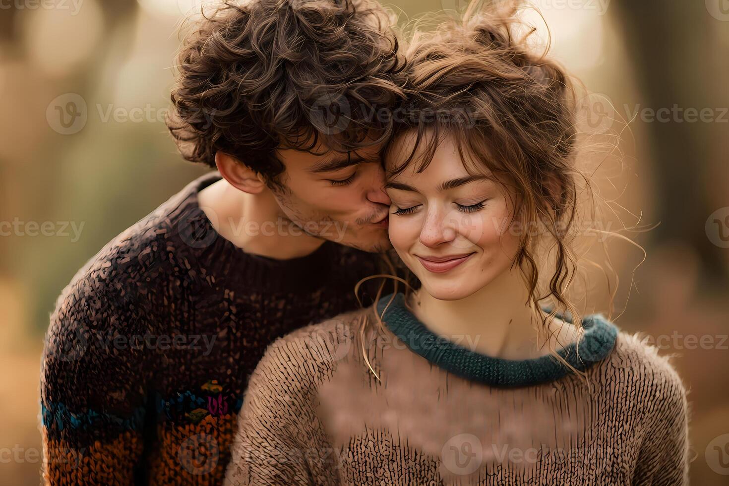 Young couple sharing a tender moment of affection in nature photo