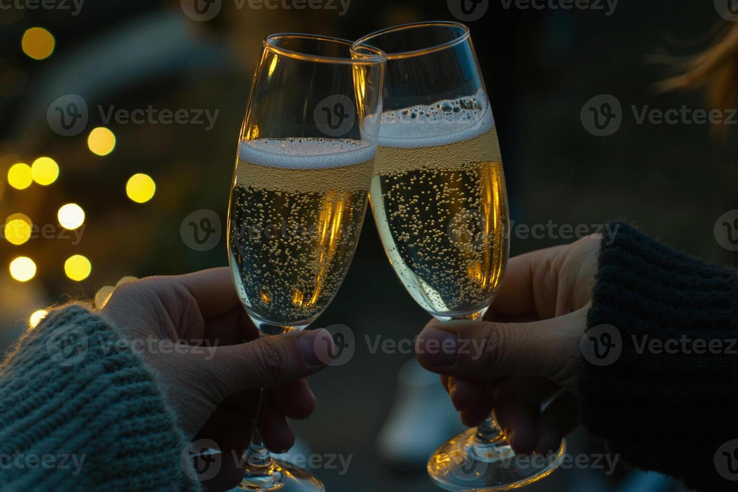 Couple clinking champagne glasses celebrating with sparkling wine in festive atmosphere photo