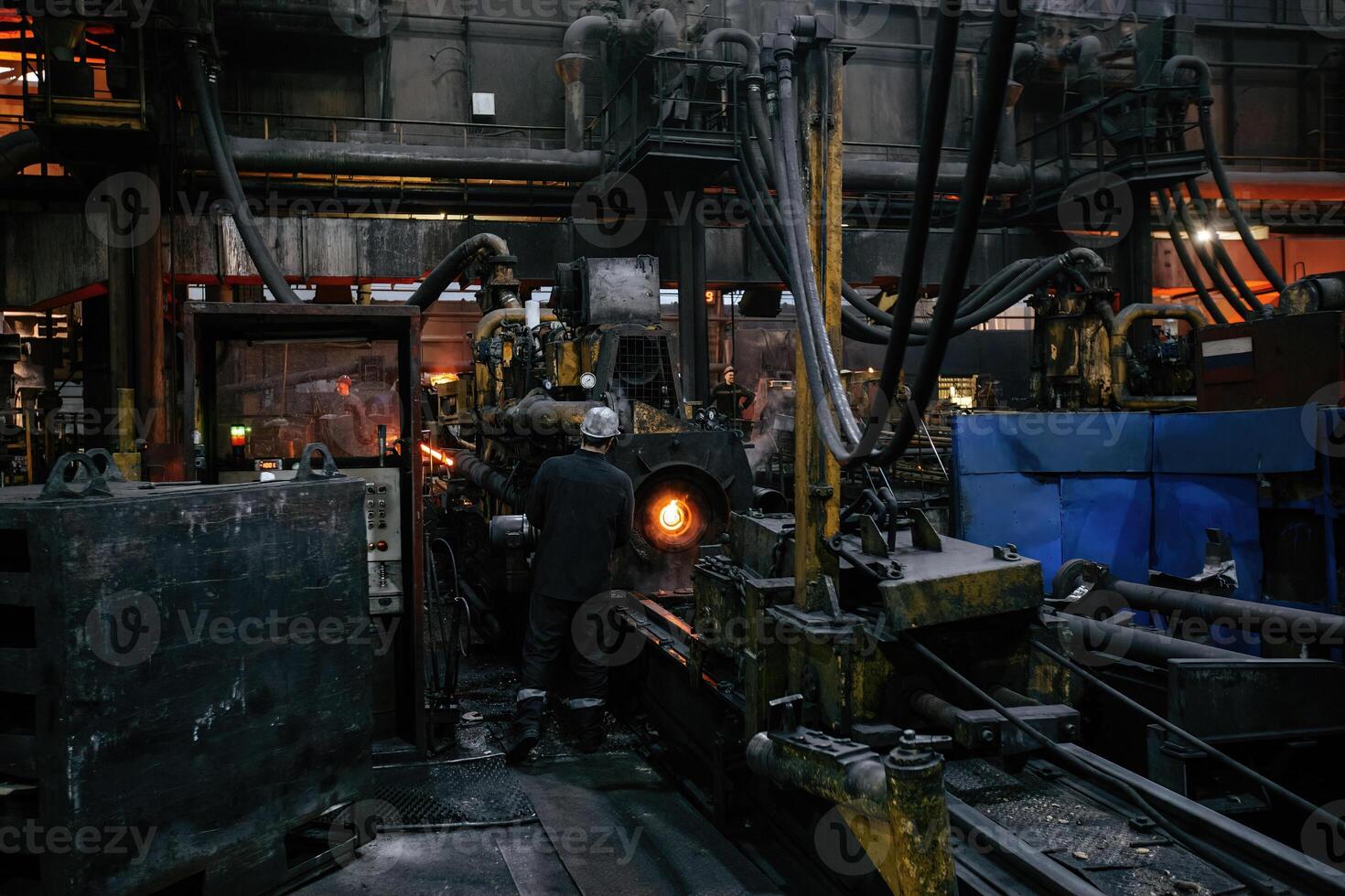 Iron pipe centrifugal pipe casting machine at the foundry. photo