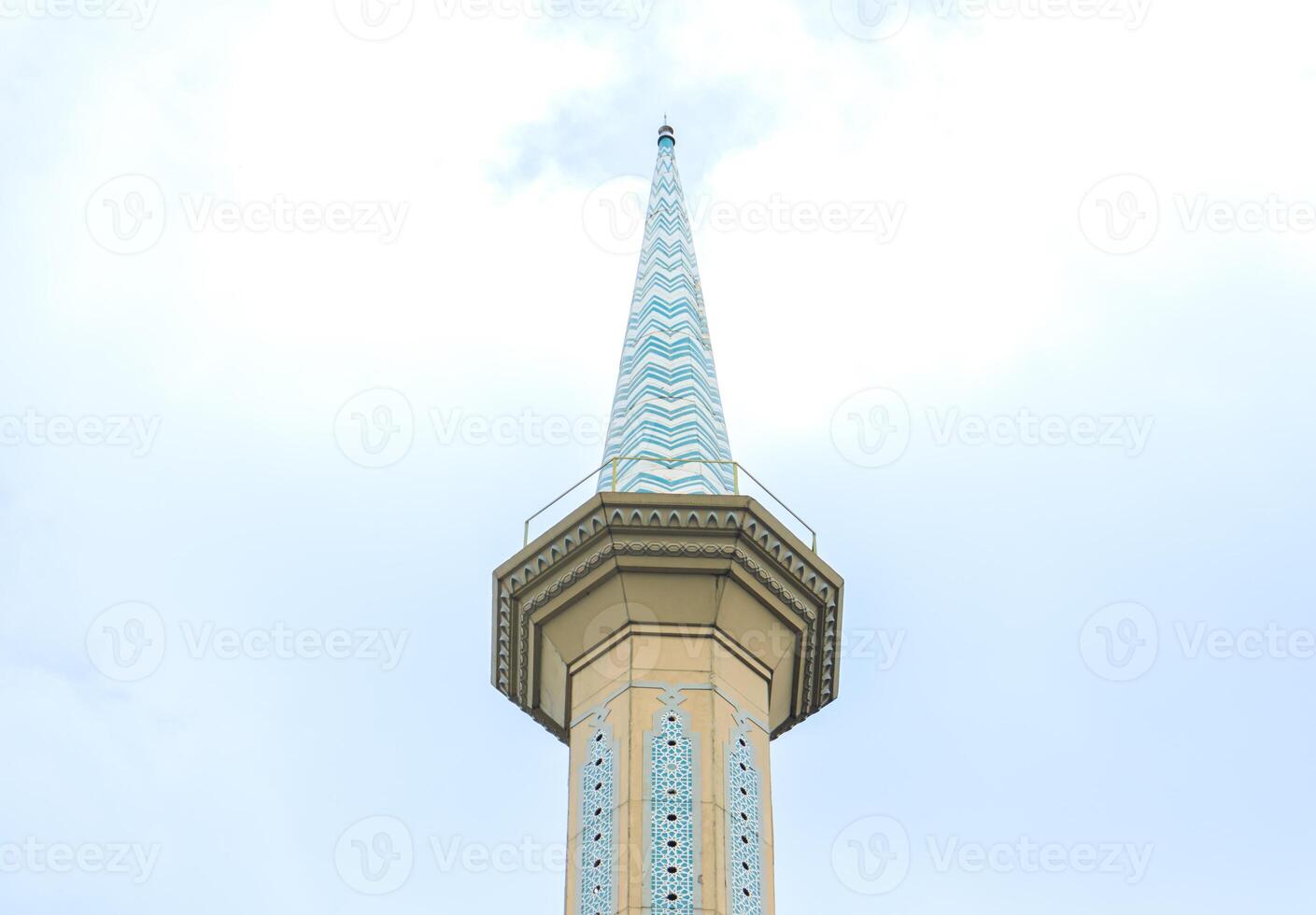 Minaret of a mosque in blue skies. After edits. photo