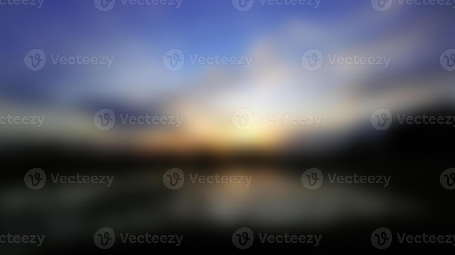 Abstract Sunrise Blurred Image with Water Reflection and Blue Sky photo