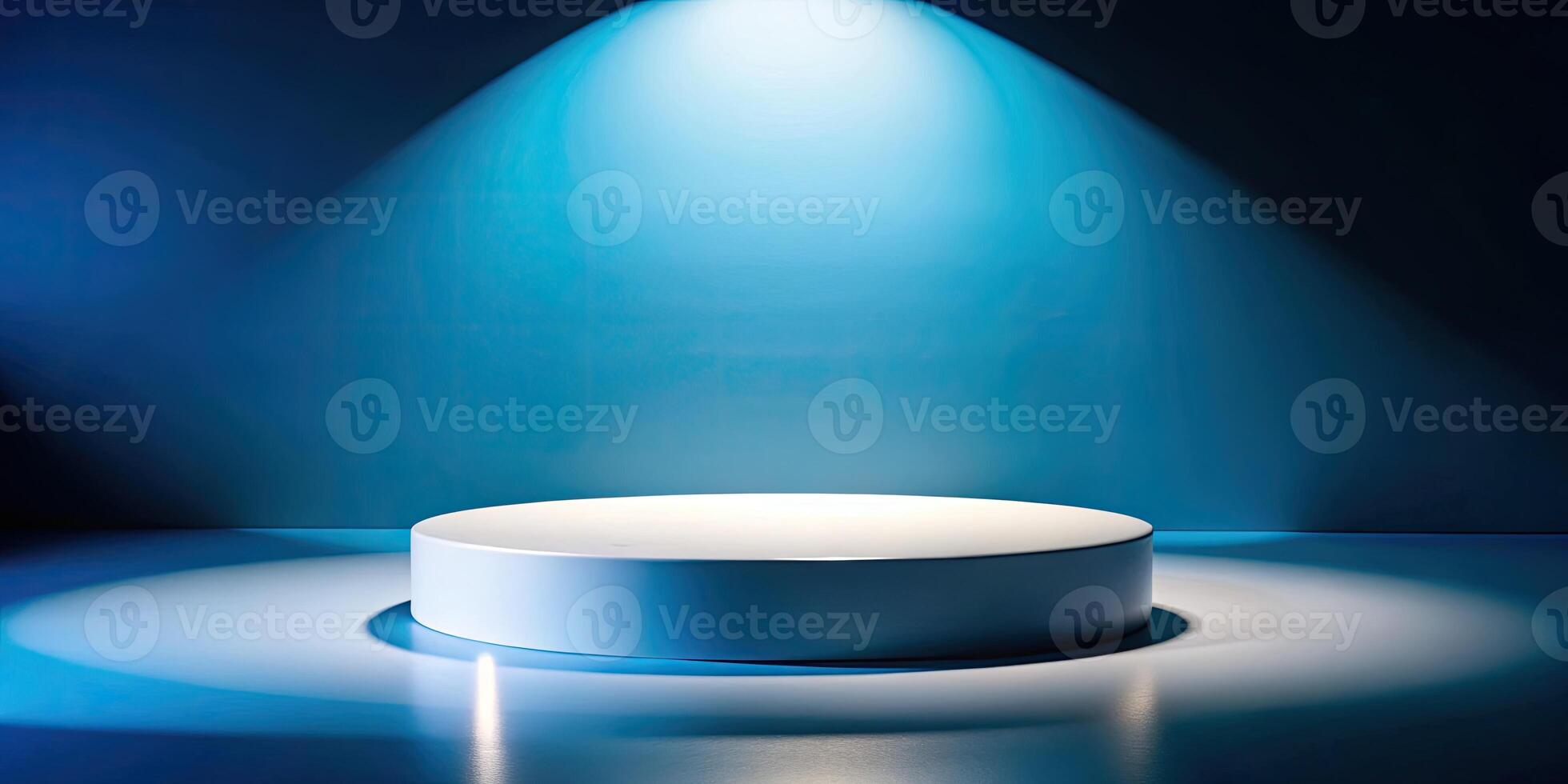Spotlight shines on a sleek circular platform in a blue room. photo