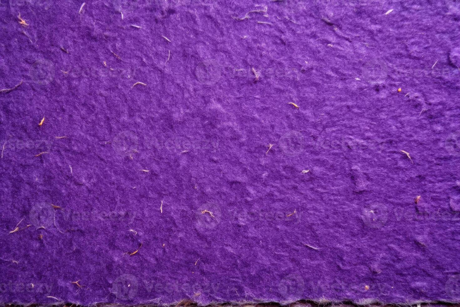 Rich purple textured paper with a handcrafted feel. photo