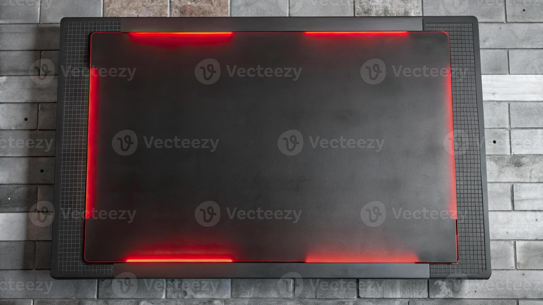Sleek black table with glowing red edge lights. photo