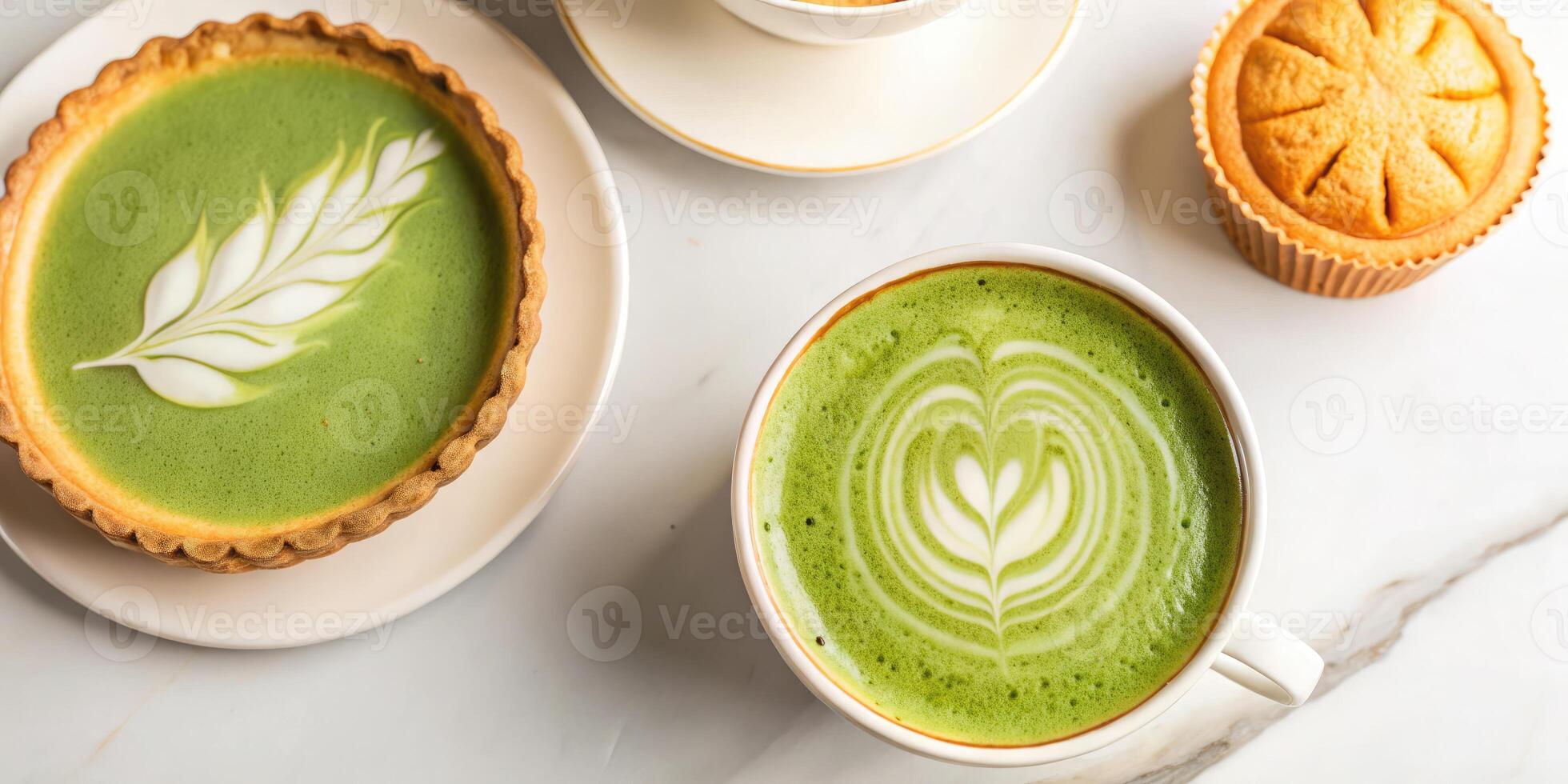Green tea latte art with a small pastry. photo