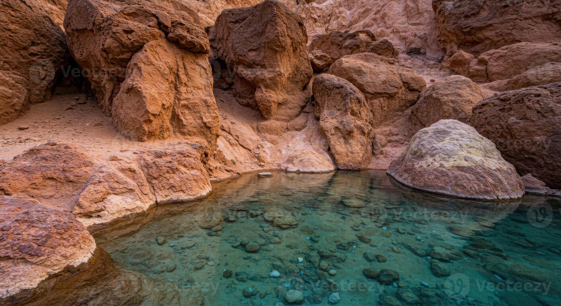 Clear Desert Rock Pool with Turquoise Water in a Canyon photo