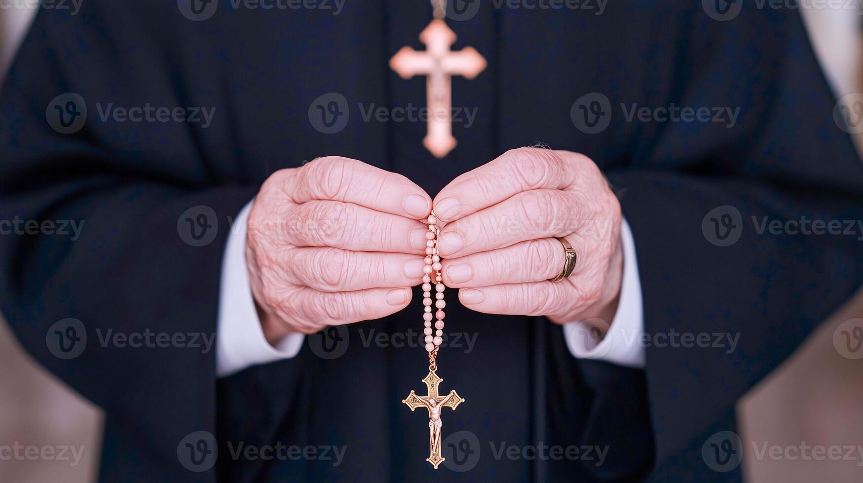 Hands Holding a Rosary with Cross photo