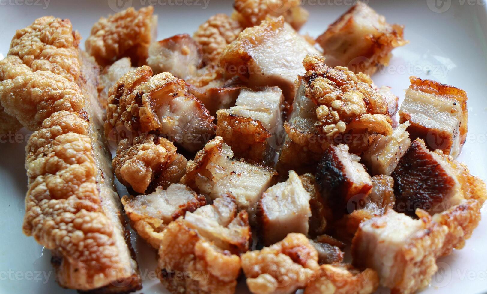 Crispy pork belly on white plate photo