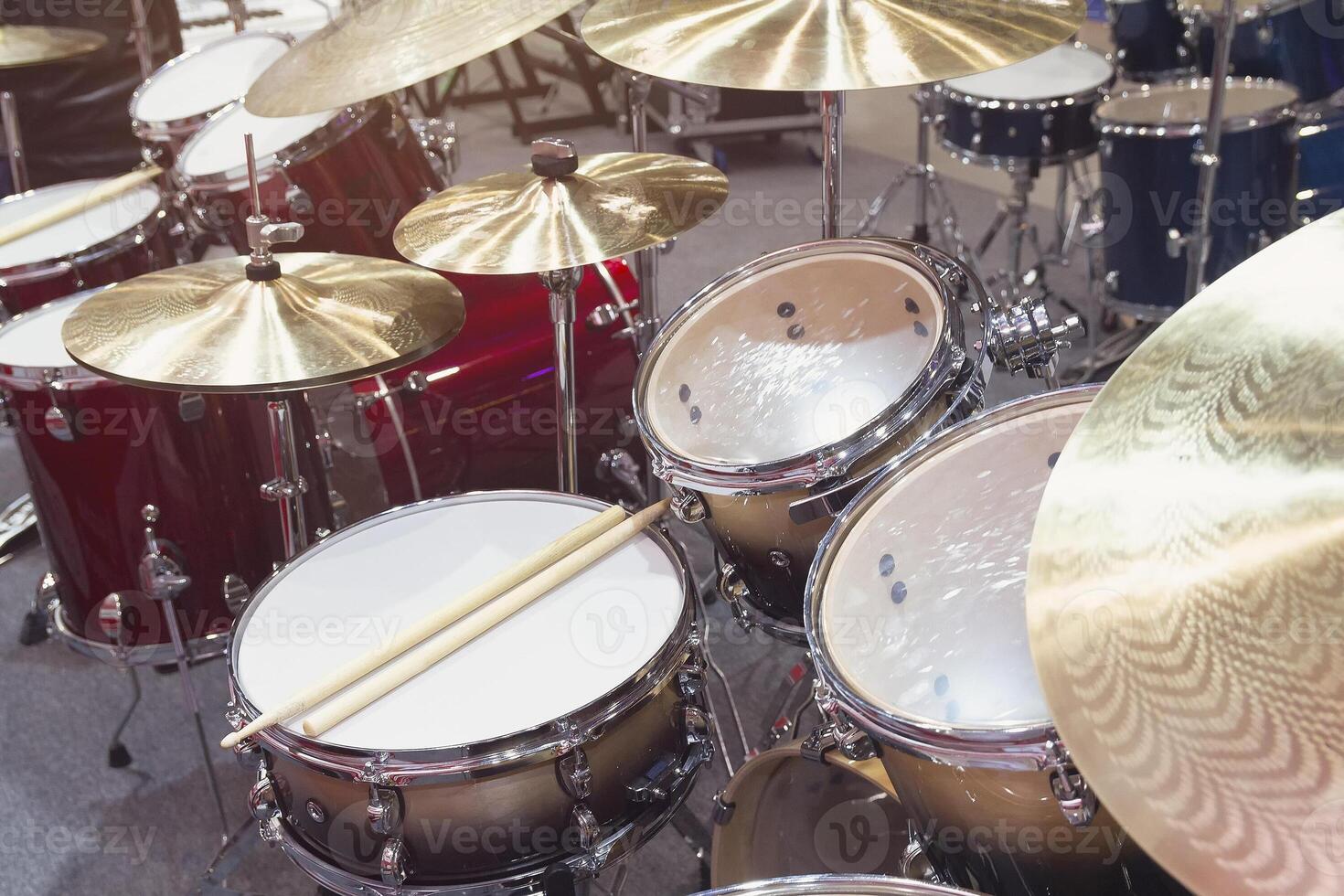 Drumsticks lying on the professional drum set. photo