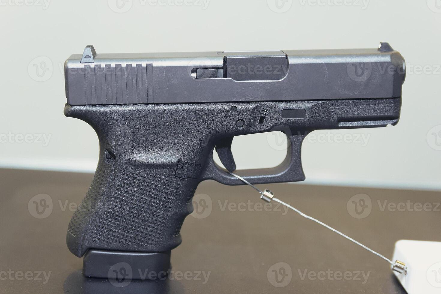 Gun on a showcase close-up photo