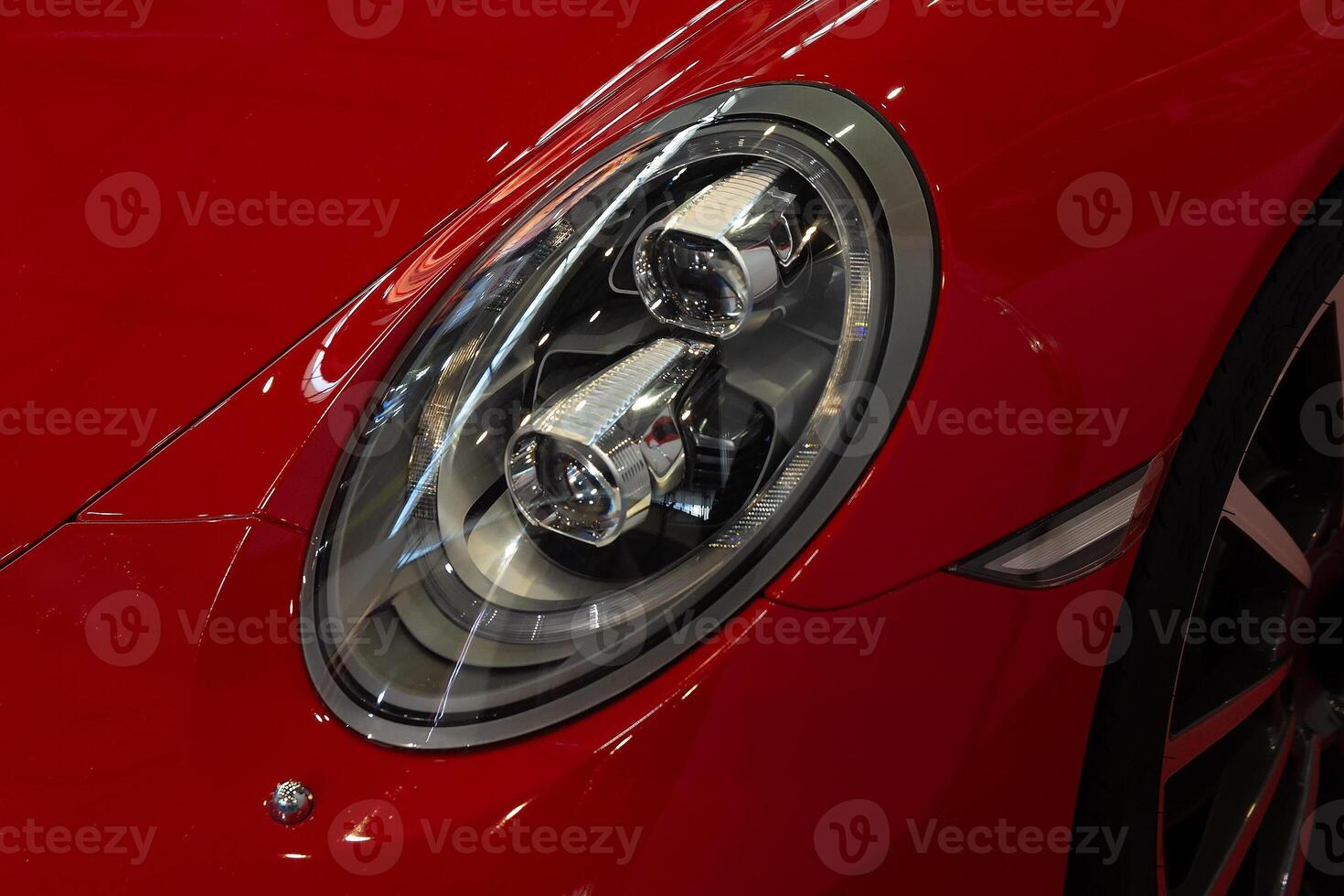 Modern sports car headlight close-up photo